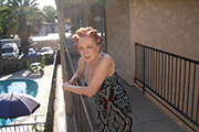 Iris Karina as Apartment Manager in the music video 'EBT California' directed by Kevin Johnson