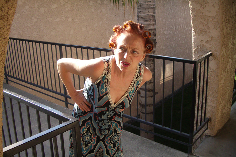 Iris Karina as Apartment Manager in the music video 'EBT California' directed by Kevin Johnson