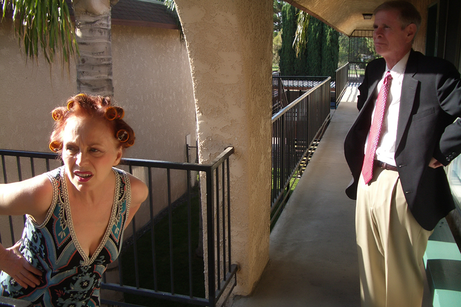 Iris Karina as Apartment Manager in the music video 'EBT California' directed by Kevin Johnson